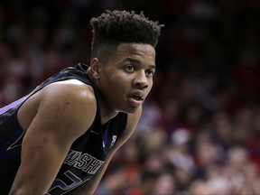 FILE - In this Jan. 29, 2017, file photo, Washington guard Markelle Fultz (20) is shown during the second half of an NCAA college basketball game against Arizona, in Tucson, Ariz. Fultz is the likely No. 1 pick in the NBA Draft on Thursday night, June 22. (AP Photo/Rick Scuteri, File)
