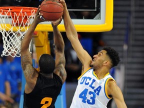 FILE - In this Jan. 9, 2016, file photo, UCLA's Jonah Bolden blocks a shot by Arizona State's Willie Atwood in the second half of an NCAA college basketball game in Los Angeles. Bolden is an Australian-born forward who played one season at UCLA, then left and has since been playing in pro leagues in Australia and Serbia. Bolden is hoping to be picked in Thursday's NBA Draft. (AP Photo/Michael Owen Baker, File)