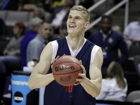 FILE - In this March 22, 2017, file photo, Arizona forward Lauri Markkanen smiles during practice in San Jose, Calif. Markkanen is a likely lottery pick in Thursday's NBA draft after one season at Arizona. (AP Photo/Marcio Jose Sanchez, File)
