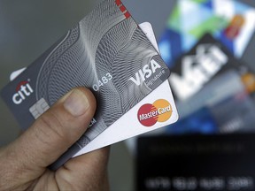 In this June 15, 2017, photo, credit cards are displayed in Haverhill, Mass. Learning that your friend has better credit than you do can be a bummer, but there are ways to improve your credit. (AP Photo/Elise Amendola)