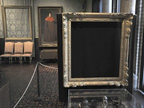 FILE - In this March 11, 2010, file photo, empty frames from which thieves took "Storm on the Sea of Galilee," left background, by Rembrandt and "The Concert," right foreground, by Vermeer, remain on display at the Isabella Stewart Gardner Museum in Boston. A Dutch sleuth has his sights set on what he calls the "Holy Grail" of stolen art: A collection worth $500 million snatched in 1990 in the largest art heist in U.S. history from Boston's Isabella Stewart Gardner Museum. (AP Photo/Josh Reynolds, File)