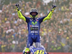 Moto GP rider Valentino Rossi of Italy celebrates after winning the Dutch Motorcycle Grand Prix, in Assen, Northern Netherlands, Sunday, June 25, 2017. (AP Photo/Geert Vanden Wijngaert)