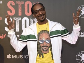 FILE - In this Wednesday, June 21, 2017, file photo, Snoop Dogg arrives at the Los Angeles premiere of "Can't Stop, Won't Stop: A Bad Boy Story" at the Writers Guild Theater on in Beverly Hills, Calif. Snoop Dogg, Shonda Rhimes, "Weird Al" Yankovic and late entertainers Bernie Mac and Steve Irwin will be receiving stars on Hollywood's Walk of Fame next year. The Hollywood Chamber of Commerce revealed the 2018 honorees Thursday. (Photo by Chris Pizzello/Invision/AP, File)