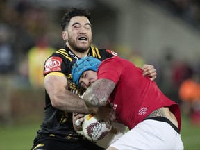 Lions fullback Jack Nowell, right,  is tackled by Hurricanes Nehe Milner-Skudder during the British and Irish Lions and the Hurricanes game in Wellington, New Zealand, Tuesday, June 27, 2017. (Brett Phibbs/New Zealand Herald via AP)