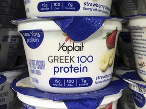 FILE - This Thursday, Feb. 23, 2017, file photo shows Yoplait Greek yogurt on display at a supermarket in Port Chester, N.Y. There's Greek yogurt, Icelandic yogurt and Australian yogurt. Now, the U.S. maker of Yoplait says it want to bring even more culture to the dairy case. General Mills is hoping a new line of French-style yogurt can help boost its sales. Its Oui line will add to the growing variety in the yogurt case. (AP Photo/Donald King, File)