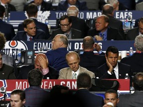 Representatives from NHL hockey teams begin their work during the second round of the NHL hockey draft, Saturday, June 24, 2017, in Chicago. (AP Photo/Nam Y. Huh)