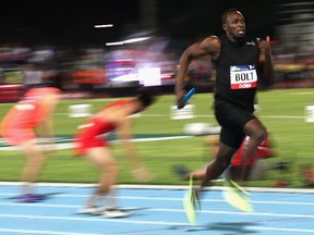 Usain Bolt of Jamaica competes in mixed 4x100-metre relay during the Melbourne Nitro Athletics Series on February 11, 2017 in Australia. A mixed 4x400-metre relay was added Friday to the Olympic program scheduled for 2020 in Tokyo.