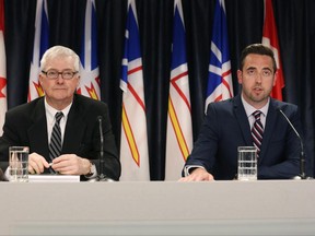 Inquiry Commissioner Leo Barry (left) and Justice Minister Andrew Parsons hold a news conference in St.John's on Tuesday, June 27, 2017 after the release of a public inquiry report into the police shooting of Newfoundland man Donald Dunphy. THE CANADIAN PRESS/Paul Daly