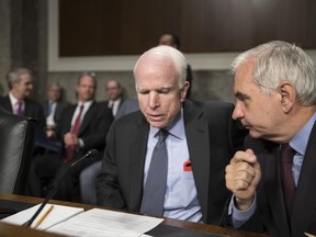 Senate Armed Services Committee Chairman John McCain, R-Ariz., left, confers with Sen. Jack Reed, D-R.I., the ranking member, at the start of a hearing at the Capitol in Washington, Tuesday, June 20, 2017.  McCain said Tuesday, North Korea "murdered" Otto Warmbier, the 22-year-old American college student who died just days after North Korea released him from detention in a coma. He had arrived in Ohio on June 13 after being held for more than 17 months.  (AP Photo/J. Scott Applewhite)