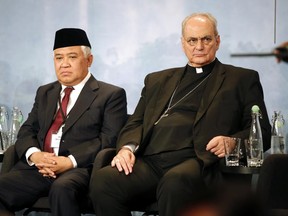 Indonesian lawmaker Din Syamsuddin, left and Marcelo Sanchez Sorondo,  Chancellor of the Pontifical Academy of Sciences and the Pontifical Academy of Social Sciences sit, during the Interfaith Rainforest Initiative in Oslo, Norway, Monday June 19, 2017.  Religious and indigenous leaders worldwide are calling for an end to deforestation in an international multi-faith, multi-cultural plea to reduce the emissions that fuel climate change, which is killing tropical rainforests. (Lise Aserud/NTB Scanpix via AP)