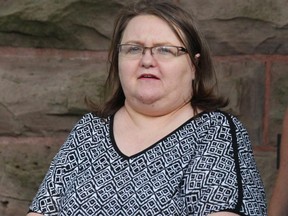 Elizabeth Wettlaufer is escorted by police from the courthouse in Woodstock, Ont, Monday, June 26, 2017