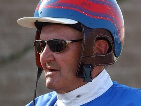 FILE - In this June 23, 2002, file photo, Herve Filion makes his return to harness racing at Harrington Raceway in Harrington, Del. Filion, the Hall of Fame harness racing driver won retired in 2012 with a then-North American record of 15,179 victories, died Thursday, June 22, 2017. He was 77. (AP Photo/Pat Crowe II, File)