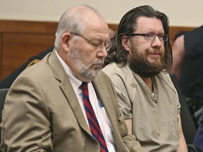 FILE – In this June 10, 2016, file photo, Lincoln Rutledge, right, attends a hearing in the Franklin County Court of Common Pleas in Columbus, Ohio. A jury convicted Rutledge of aggravated murder Thursday, June 22, 2017, for fatally shooting Columbus, Ohio, SWAT officer Steven M. Smith in the head April 10, 2016, as officers tried to arrest Rutledge on an arson warrant. Smith died two days later. (Chris Russell/The Columbus Dispatch via AP)
