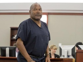 FILE - In this May 15, 2013, file photo, O.J. Simpson returns to the witness stand to testify after a break during an evidentiary hearing in Clark County District Court in Las Vegas. Simpson has a July 20 parole hearing that could have him released from a Nevada prison on Oct. 1, a state parole official said Tuesday, June 20, 2017. (AP Photo/Julie Jacobson, Pool, File)