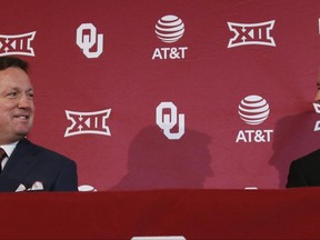 In this Wednesday, June 7, 2017 photo, Oklahoma football coach Bob Stoops, left, who resigned, and incoming coach Lincoln Riley, right, smile during a news conference in Norman, Okla. Oklahoma's Board of Regents formally approved Riley's hiring during a meeting Tuesday, June 20. (AP Photo/Sue Ogrocki)