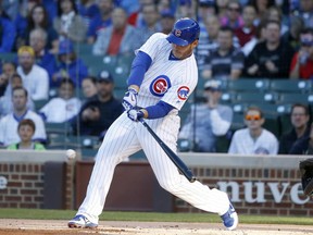 Chicago Cubs' Anthony Rizzo swings into a lead off home run against San Diego Padres starting pitcher Jhoulys Chacin during the first inning of a baseball game Tuesday, June 20, 2017, in Chicago. (AP Photo/Charles Rex Arbogast)