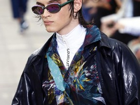A model wears a creation as part of Louis Vuitton Men's Spring Summer 2018 fashion collection, presented in Paris, France, Thursday, June 22, 2017. (AP Photo/Francois Mori)