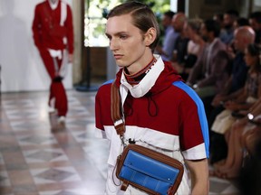A model wears a creation as part of Valentino Men's Spring Summer 2018 fashion collection, presented in Paris France, Wednesday, June 21, 2017. (AP Photo/Francois Mori)