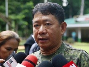 FILE - In this May 26, 2017, file photo, Philippine Armed Forces chief and administrator of Martial Law Gen. Eduardo Ano talks to reporters during his visit to a military camp on the outskirts of Iligan city in southern Philippines. The Philippine military chief said Friday, June 23, 2017, Malaysian militant Mahmud bin Ahma who helped lead and finance the siege in southern Marawi city has been killed in one of the setbacks to the uprising by locals aligned with the Islamic State group. (AP Photo/Bullit Marquez, File)