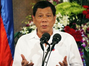 Philippine President Rodrigo Duterte gestures while addressing Filipino Muslim leaders during a reception at the Presidential Palace to celebrate the end of the Holy Month of Ramadan known as Eid al-Fitr in Manila, Philippines Tuesday, June 27, 2017