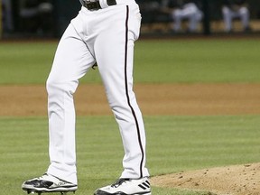 Arizona Diamondbacks' Robbie Ray pauses after giving up a two-run home run to Philadelphia Phillies' Ben Lively during the fourth inning of a baseball game Saturday, June 24, 2017, in Phoenix. (AP Photo/Ross D. Franklin)