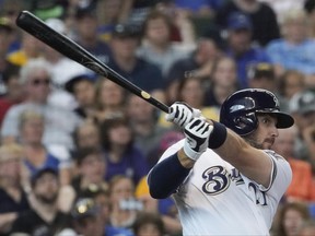 Milwaukee Brewers' Travis Shaw hits an RBI double during the fifth inning of a baseball game against the Pittsburgh Pirates Thursday, June 22, 2017, in Milwaukee. (AP Photo/Morry Gash)