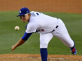 FILE - In this May 9, 2017, file photo, Los Angeles Dodgers starting pitcher Julio Urias throws during the team's baseball game against the Pittsburgh Pirates in Los Angeles. Urias, the Dodgers' top prospect, needs shoulder surgery and will miss the rest of the season. The 20-year-old is scheduled to have his left anterior capsule repaired Tuesday, June 27. (AP Photo/Mark J. Terrill, File)