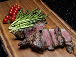 Ray's grilled bone-in rib steak with grilled asparagus.