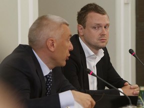 The son of European Council head, Donald Tusk, Michal Tusk, right, and his lawyer Roman Giertych, left,  attend a special parliamentary commission session  in Warsaw, Poland, Wednesday, June 21, 2017. The commission is questioning Tusk about his work for an airline that was a subsidiary of Amber Gold financial firm that turned out to be a pyramid scheme. (AP Photo/Czarek Sokolowski)