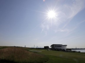 In a photo taken Tuesday, June 13, 2017, in Jersey City, N.J., the sun shines on the clubhouse at Liberty National Golf Club, which will host the Presidents Cup in late September. (AP Photo/Julio Cortez)