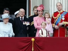 From left, Britain's Queen Elizabeth II, Prince Philip, the Duke of Edinburgh, Kate, The Duchess of Cambridge, Prince William and their children Prince George and Princess Charlotte appear on the balcony of Buckingham Palace June 17, 2017.