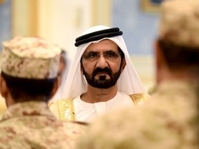 Sheikh Mohammed Bin Rashid al-Maktoum, ruler of Dubai looks on as he is welcomed by Saudi King Salman bin Abdulaziz (unseen) upon his arrival for the Gulf Cooperation Council (GCC) summit in Riyadh on May 5, 2015. The GCC summit came amid mounting international concern over the Saudi-led air war on Shiite rebels in Yemen, the threat from jihadists and Gulf worries over their Shiite rival Iran.