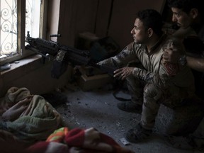 Iraqi special forces soldiers watch Islamic State positions at the frontline near the al-Nuri mosque in the Old City of Mosul, Iraq, Wednesday, June 28, 2017