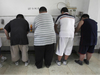 Obese patients wash their plates after lunch at the Aimin Fat Reduction Hospital in Tianjin, China. The hospital uses a combination of diet, exercise and traditional Chinese acupuncture to treat rising obesity rates.