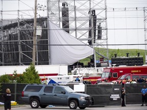 Emergency personnel are on scene near a collapsed stage at Downsview Park in Toronto on Saturday, June 16, 2012. A new trial has been ordered for those charged in a deadly stage collapse at an outdoor Radiohead concert in Toronto, sending the case back to square one five years after the grim incident. THE CANADIAN PRESS/Nathan Denette