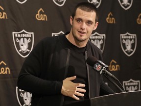 FILE - In this Nov. 27, 2016, file photo, Oakland Raiders quarterback Derek Carr speaks at a news conference after an NFL football game against the Carolina Panthers, in Oakland, Calif. Raiders quarterback Derek Carr has finalized a five-year contract extension that will keep him tied to the team through the 2022 season. Carr tweeted Thursday, June 22, 2017, that an agreement had been reached to add five years to his current rookie deal that expires after this season. The contract will be worth $125 million, according to a person familiar with the deal who spoke on condition of anonymity because terms were not released. (AP Photo/Marcio Jose Sanchez, File)