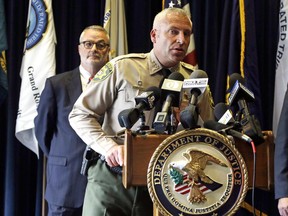 Deschutes County Sheriff Shane Nelson, right, speaks during a press conference as U.S. Attorney for the District of Oregon Billy J. Williams stands behind him in Portland, Ore., Wednesday, June 28, 2017, after the indictment of an FBI agent. FBI special agent W. Joseph Astarita pleaded not guilty to charges that he lied about shooting at a key figure in last year's armed occupation of a national wildlife refuge just before the man was killed by Oregon police. (AP Photo/Don Ryan)