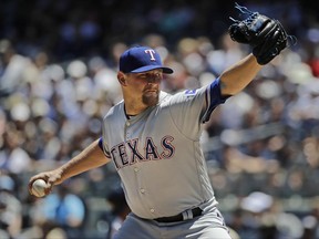 Texas Rangers' Austin Bibens-Dirkx delivers a pitch during the first inning of a baseball game against the New York Yankees Saturday, June 24, 2017, in New York. (AP Photo/Frank Franklin II)