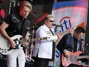 FILE - In this  May 22, 2017, file photo, Rascal Flatts band members, from left, Joe Don Rooney, Gary LeVox and Jay DeMarcus perform on NBC's "Today" show at Rockefeller Plaza in New York. The band surprised a bride and groom in Watertown, Wisconsin, on Saturday, June 24, 2017. (Photo by Charles Sykes/Invision/AP, File)