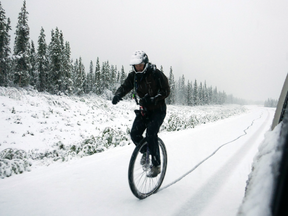Ned Rozbicki, captain of the unicycle team, rides through a snowy road at this year's Kluane Chilkat International Bike Relay.