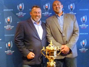 Former Canada captains Gareth Rees (left) and Al Charron pose with the Webb Ellis Cup, which goes to the Rugby World Cup winner, in Toronto on Wednesday June 21, 2017. The cup is in town to make the first leg of the Canada-U.S. World Cup qualifier in Hamilton, Ont. on Saturday. THE CANADIAN PRESS/Neil Davidson