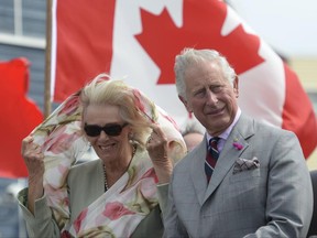 Prince Charles and Camilla, the Duchess of Cornwall, look on after arriving in Iqaluit, Nunavut, Thursday, June 29, 2017. THE CANADIAN PRESS/Adrian Wyld