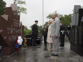 Prince Charles and Camilla Duchess of Cornwall pause after laying a wreath at the Afghanistan Memorial Friday June 30, 2017 in Trenton. THE CANADIAN PRESS/Adrian Wyld