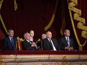 Russian President Vladimir Putin, center, Brazilian President Michel Temer, left, and Senator Paulo Bauer, right, attend a concert of winners of the XIII International Ballet Competition in the Bolshoi Theater in Moscow, Russia, Tuesday, June 20, 2017. At left back, Bolshoi Theater director Vladimir Urin. (Alexei Druzhinin/Sputnik, Kremlin Pool Photo via AP)