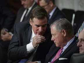Senate Intelligence Committee Chairman Sen. Richard Burr, R-N.C., right, and committee Vice Chairman Mark Warner, D-Va., confer on Capitol Hill in WashingtonWednesday, June 28, 2017, as the panel conducts a hearing on Russian intervention in European elections in light of revelations by American intelligence agencies that blame Russia for meddling in the 2016 U.S. election.  (AP Photo/J. Scott Applewhite)