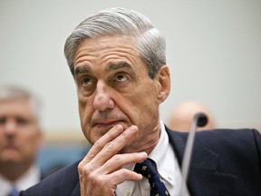 FILE - In this June 13, 2013 file photo, FBI Director Robert Mueller listens as he testifies on Capitol Hill in Washington, as the House Judiciary Committee held an oversight hearing on the FBI.  Special Counsel Robert Mueller's team of lawyers investigating potential coordination between Russia and the Trump campaign is still growing, but its early composition reveals a breadth of experience in criminal law and in following the money.  (AP Photo/J. Scott Applewhite)