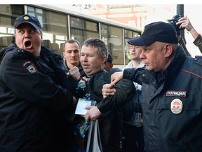 Russian police officers detain human rights activist Dinar Idrisov  in Saint Petersburg on June 13, 2017.