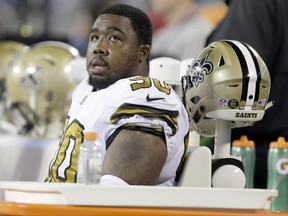FILE - In this Nov. 17, 2016, file photo, New Orleans Saints' Nick Fairley (90) watches from the bench during the first half of an NFL football game against the Carolina Panthers in Charlotte, N.C. Saints general manager Mickey Loomis says Fairley has been placed on the team's non-football illness list, meaning the starting defensive tackle won't play this season. This offseason he's been visiting heart specialists because of symptoms related to an enlarged heart. (AP Photo/Bob Leverone, File)