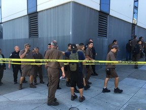 UPS workers gather outside after a reported shooting at a UPS warehouse and customer service center in San Francisco on Wednesday, June 14, 2017.
