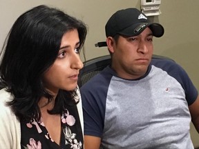 Attorney Saira Hussain, left, and her client, Pedro Figueroa-Zarceno, answer questions about a settlement with the city of San Francisco on Thursday, June 29 , 2017, in San Francisco. Figueroa-Zarceno, a native from El Salvador in the U.S. illegally, sued San Francisco after police turned him over to immigration authorities in violation of the city's sanctuary law and is set to be awarded $190,000 according to Hussain. (AP Photo/Olga Rodriguez)